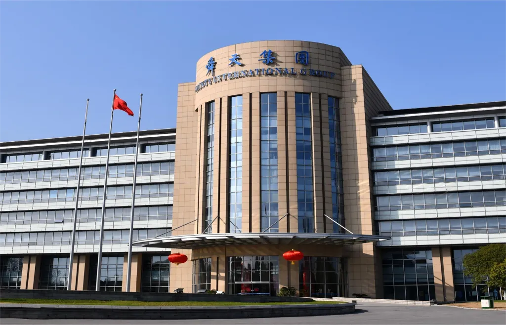 A building with customized flange flags in front of it.